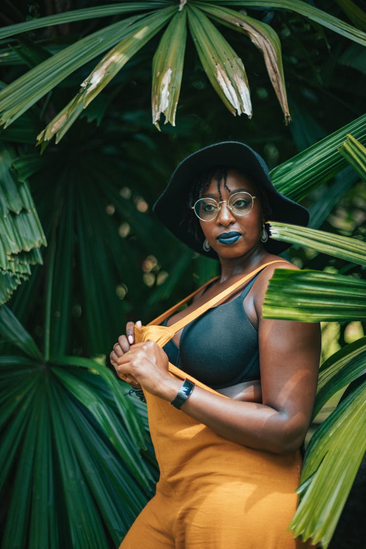 Black Woman Among Green Palm Branches