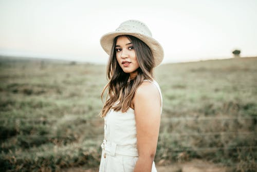 Woman Wearing White Dress And Hat