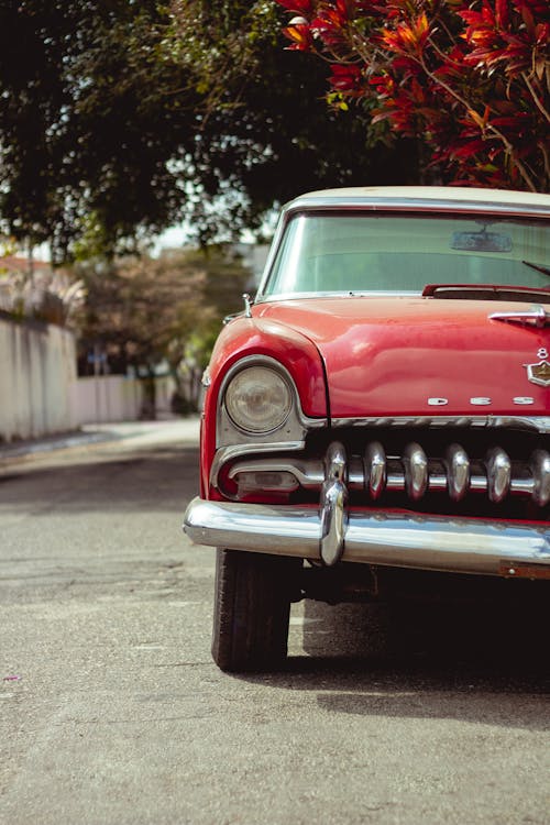 Free Vintage Red Car Parked on the Street Stock Photo