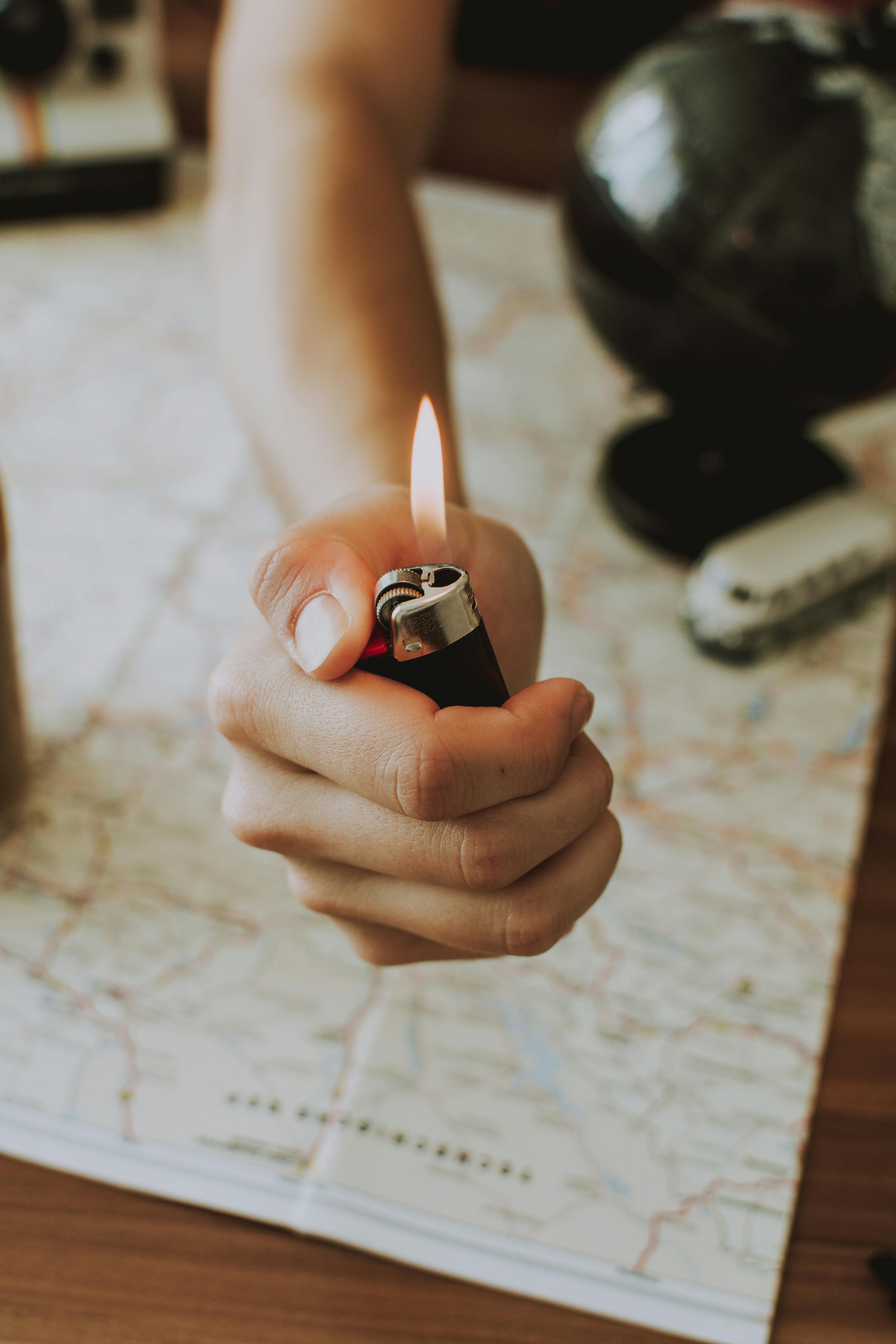 Person Holding A Lighter · Free Stock Photo