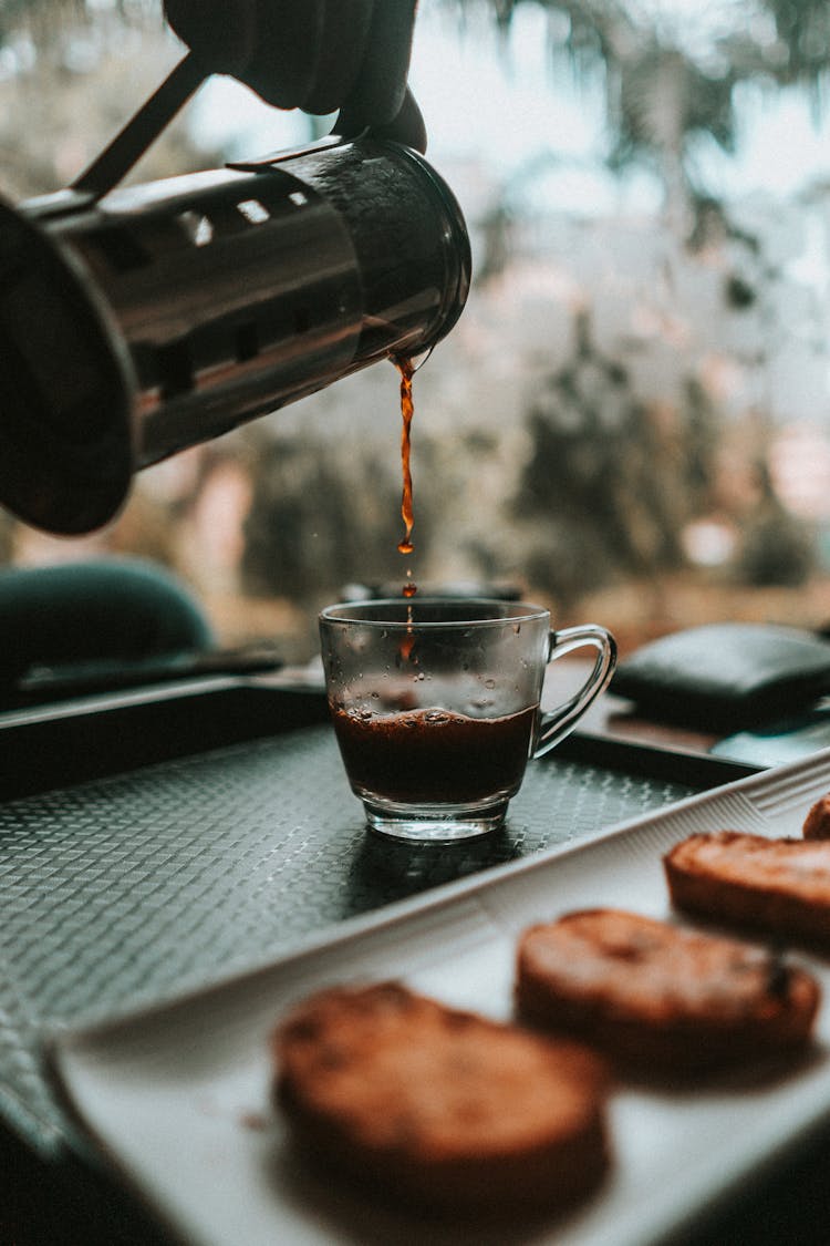 Pouring Coffee In Clear Glass Mug 