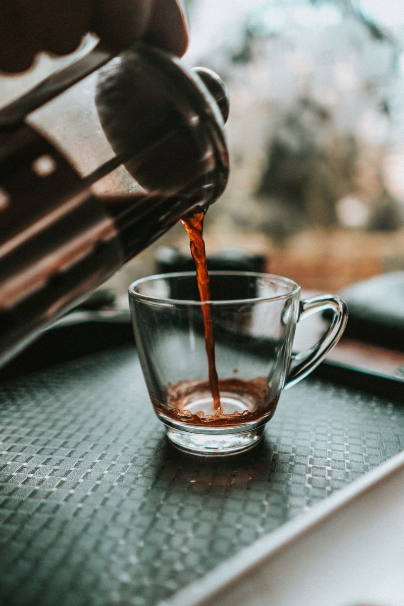 Barista pouring coffee with steady hands