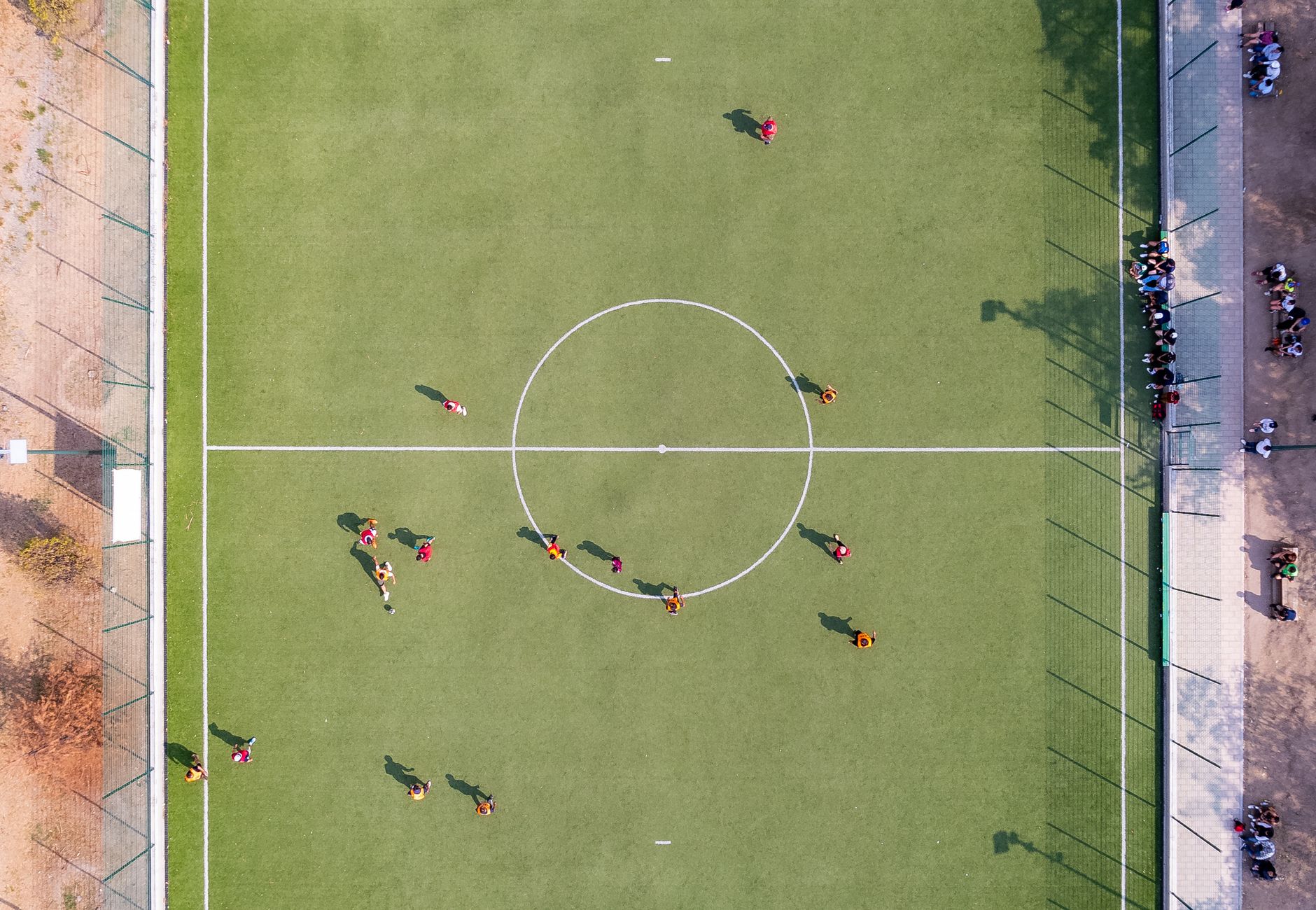 Aerial view of a football match, like a tactical camera angle