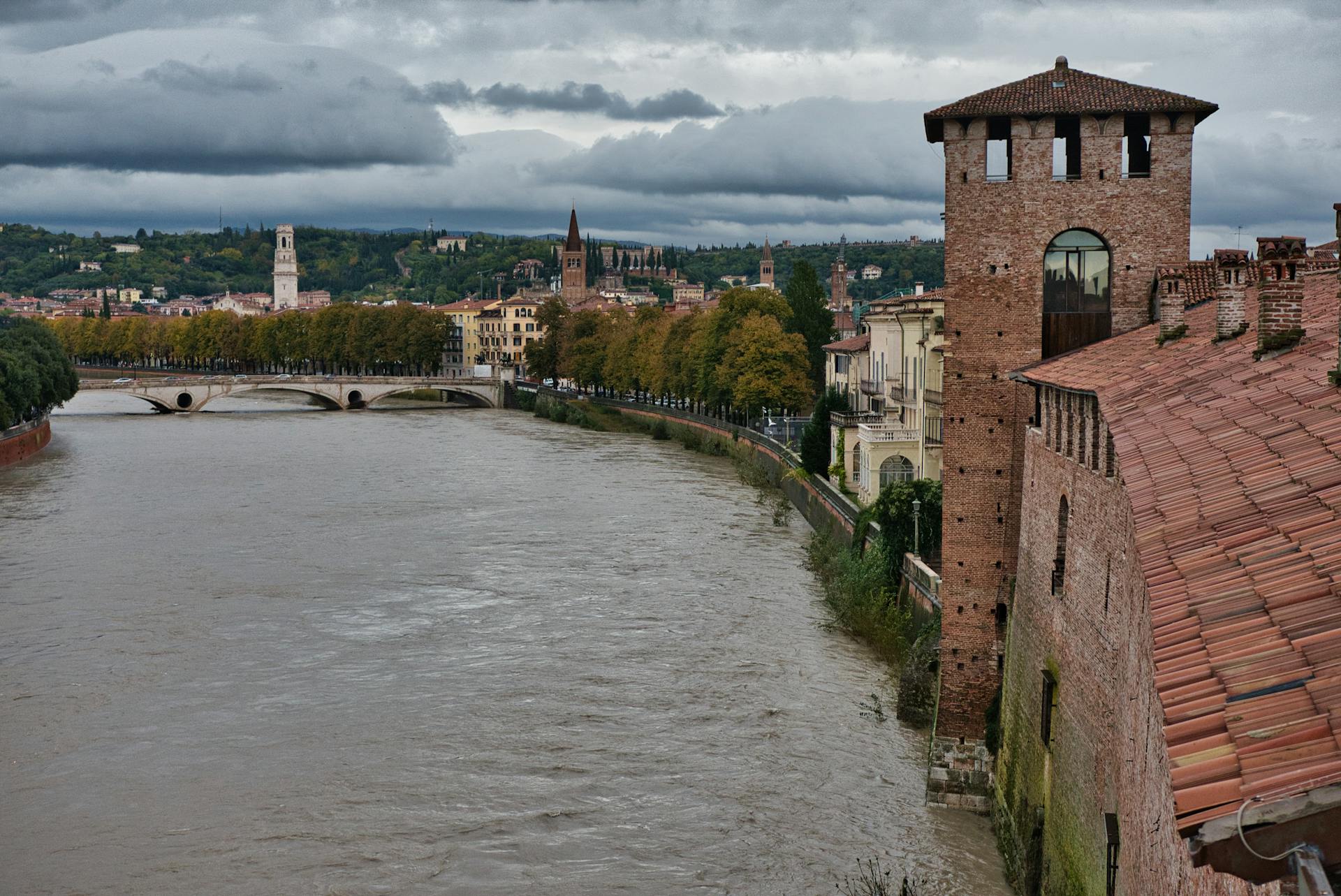 Capture of Verona's scenic skyline featuring medieval architecture along the river.