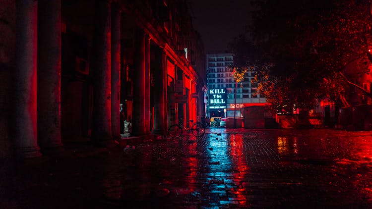 Parking Area With Reflection Of Red Light