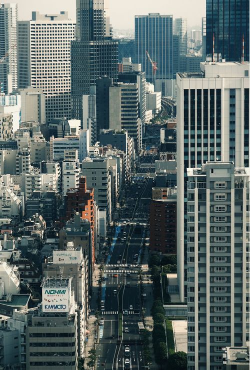 Free Stunning aerial view of a modern cityscape with towering skyscrapers and vibrant streets. Stock Photo