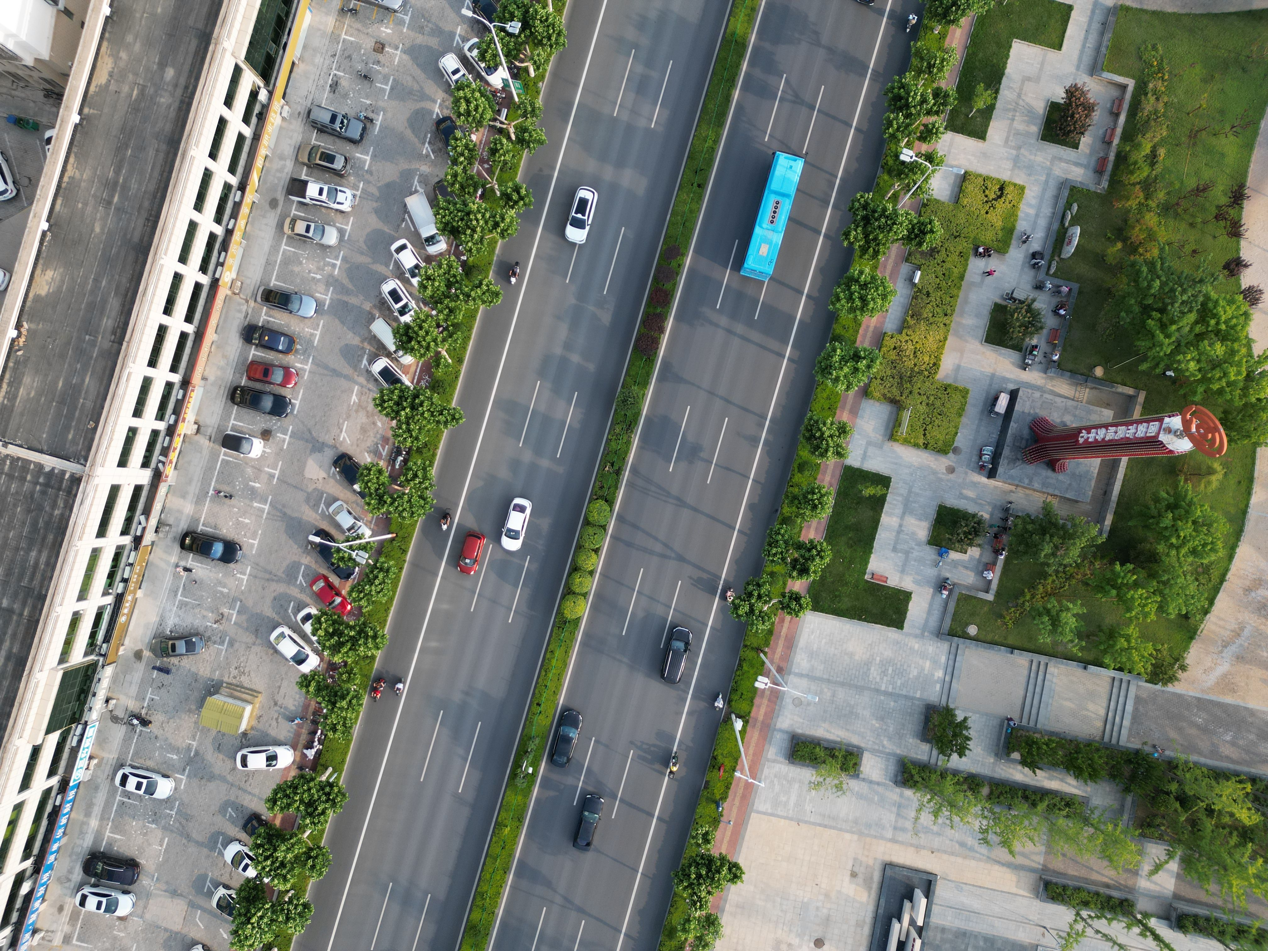 An aerial view of a busy street with cars and buses · Free Stock Photo