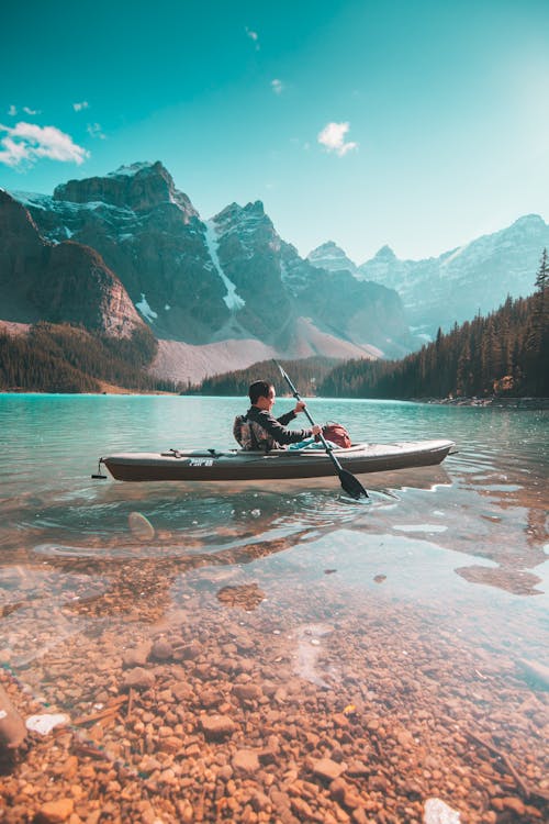 Free Person Riding on Gray Kayak Stock Photo