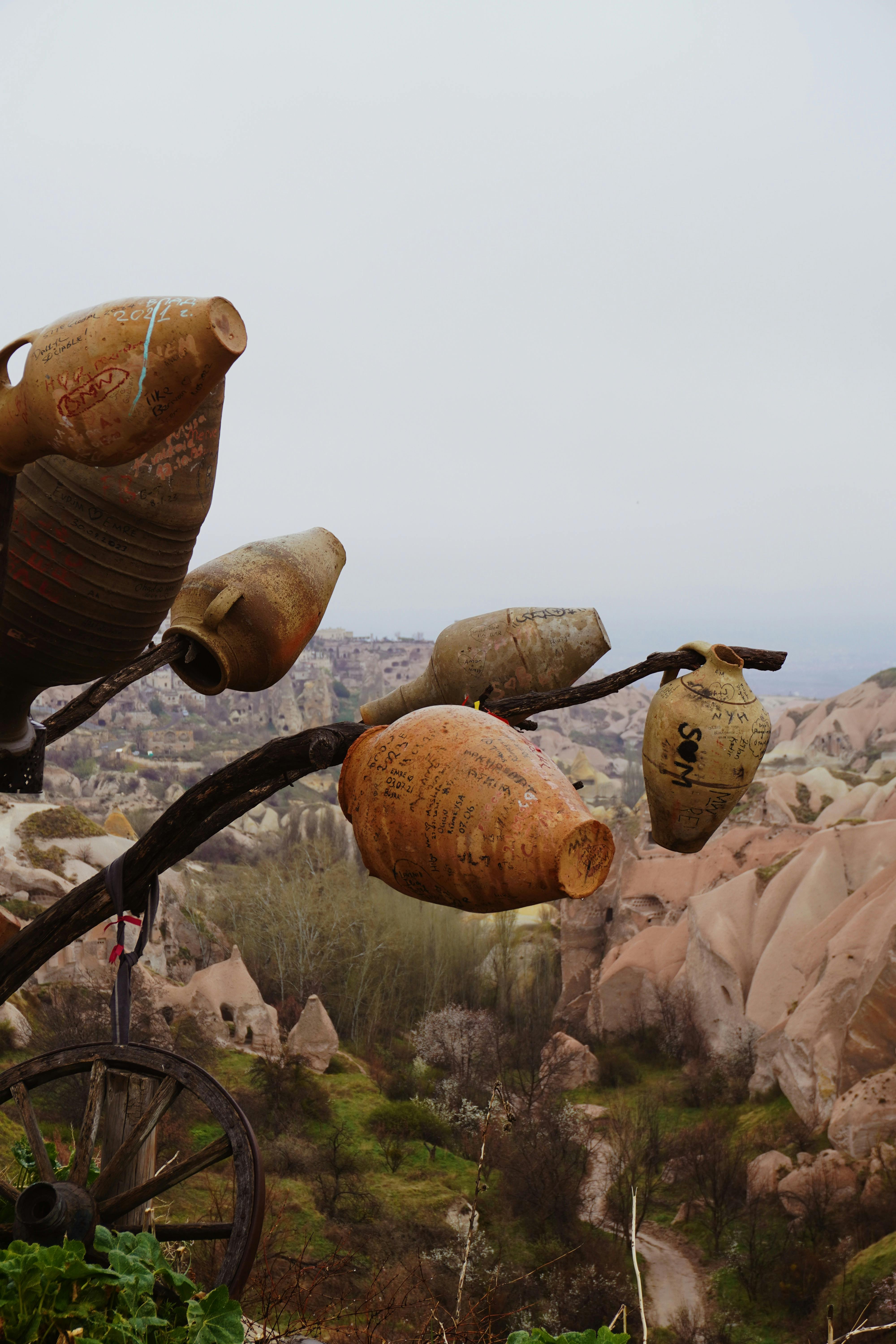 a bunch of pots on a hillside