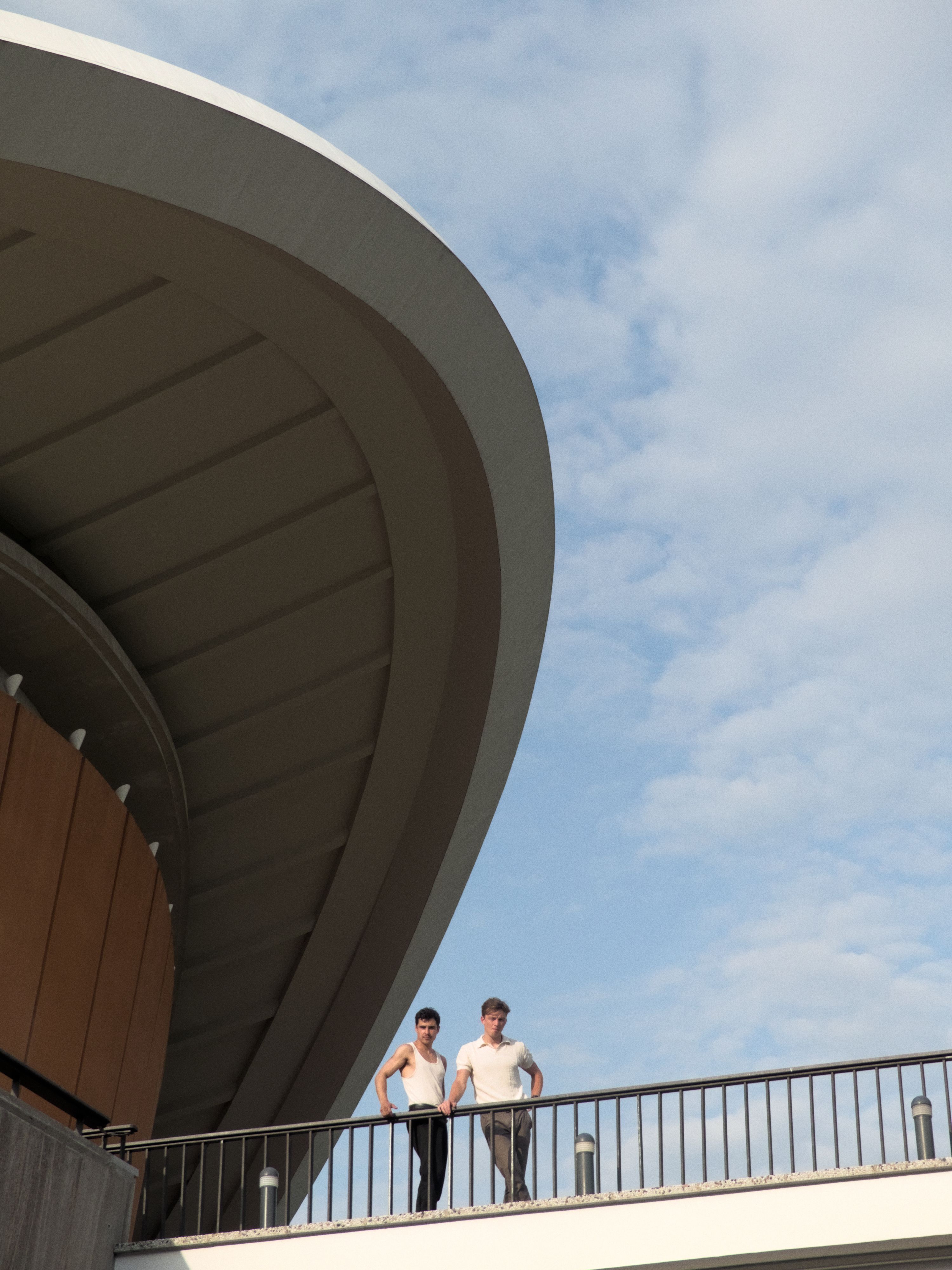 Couple Standing on Bridge Holding onto Railing under Cloudy Sky · Free ...