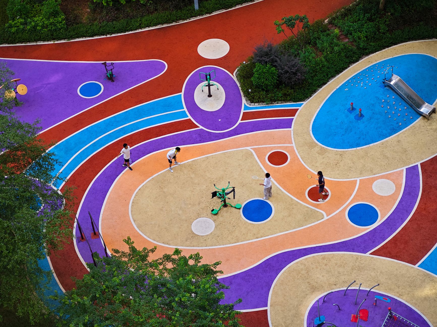 Colorful aerial view of an urban playground in Zhaoqing City with children playing.
