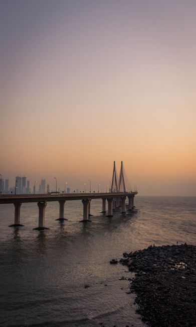 Beautiful sunset view of a modern bridge in Mumbai, India, creating a tranquil and picturesque scene.