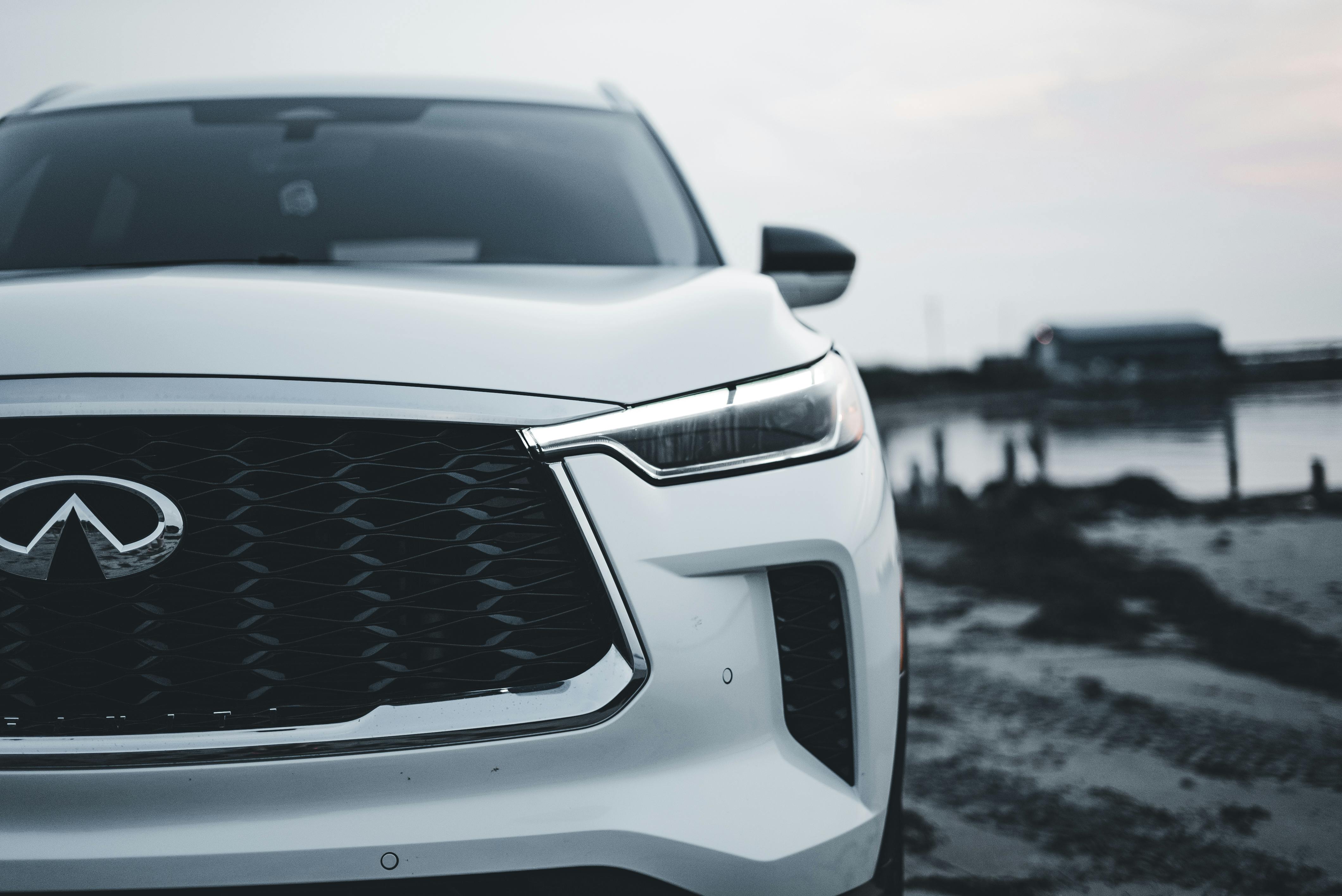 stylish luxury sedan on a coastal highway - best highway gas mileage car