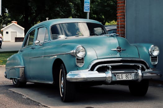A beautifully restored vintage car displayed on a street in Jönköping, Sweden, showcasing classic automotive design.