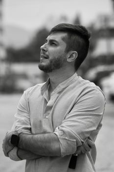 Profile portrait of a pensive man outdoors in Blumenau, Brazil, capturing a thoughtful moment.
