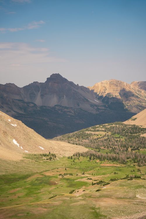 Free Breathtaking landscape in High Uintas Wilderness, showcasing rugged peaks and green valleys under a clear sky. Stock Photo