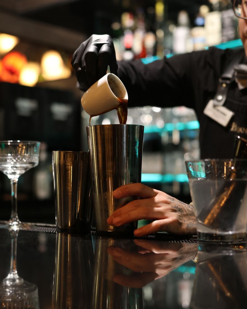 A bartender mixing a drink