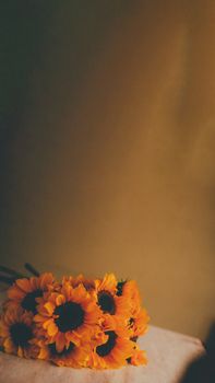 A bright and vivid bouquet of sunflowers set against a retro background, exuding warmth and nostalgia.