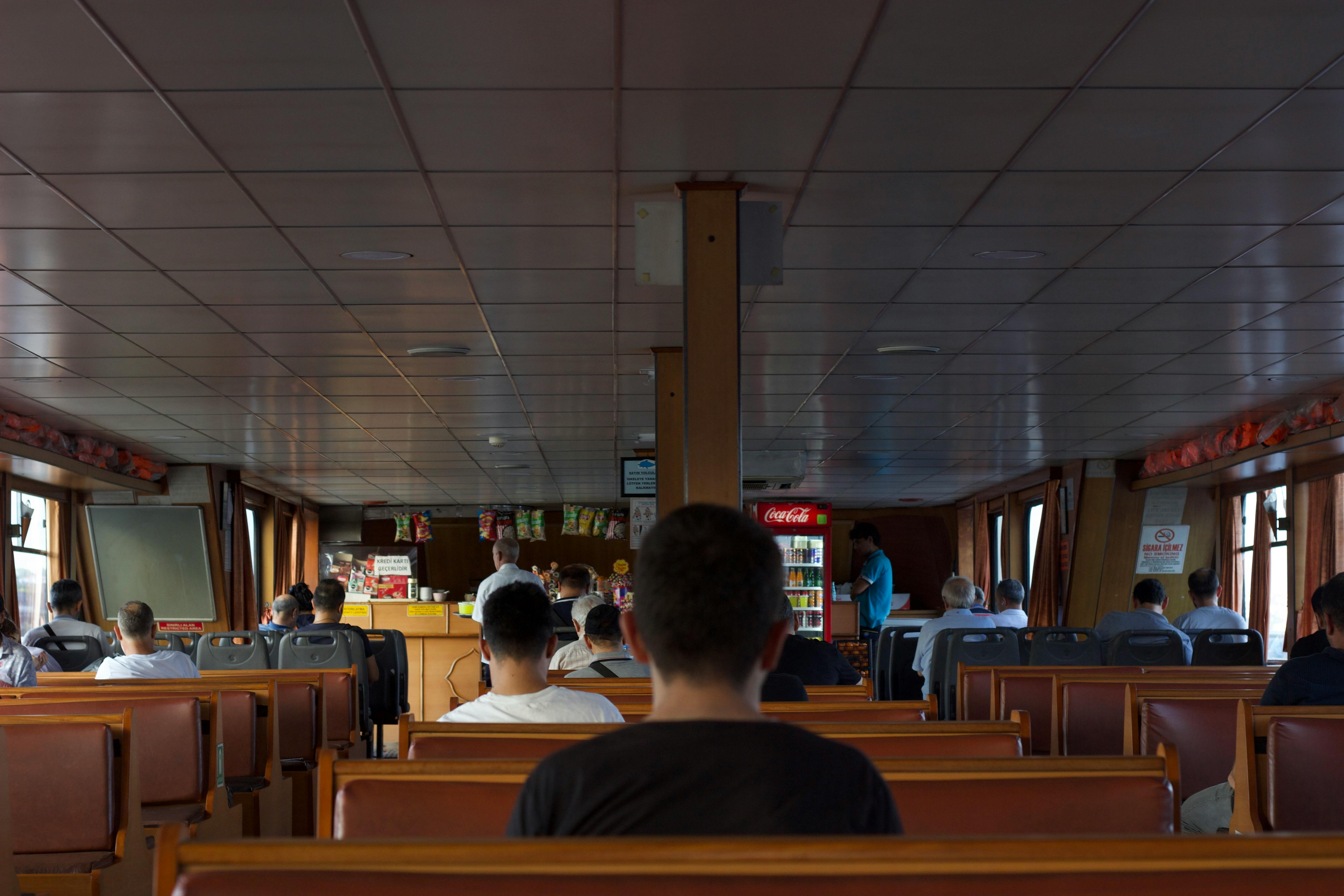 a group of people sitting in a boat