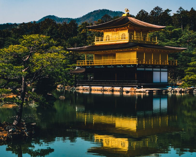 Stunning view of the Golden Pavilion reflected in a serene lake at Kinkaku-ji Temple, Kyoto.