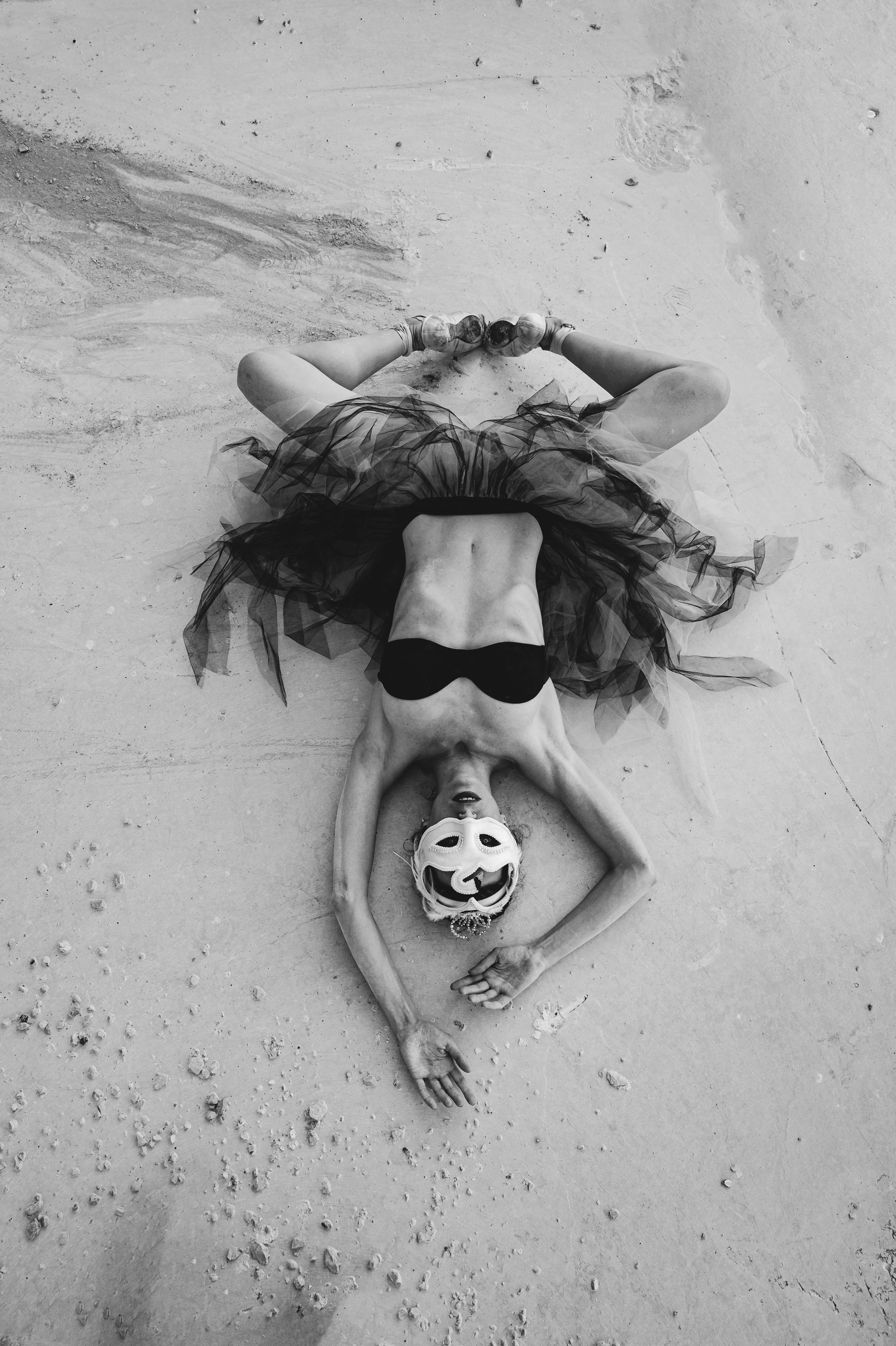 black and white photo of a woman wearing a costume