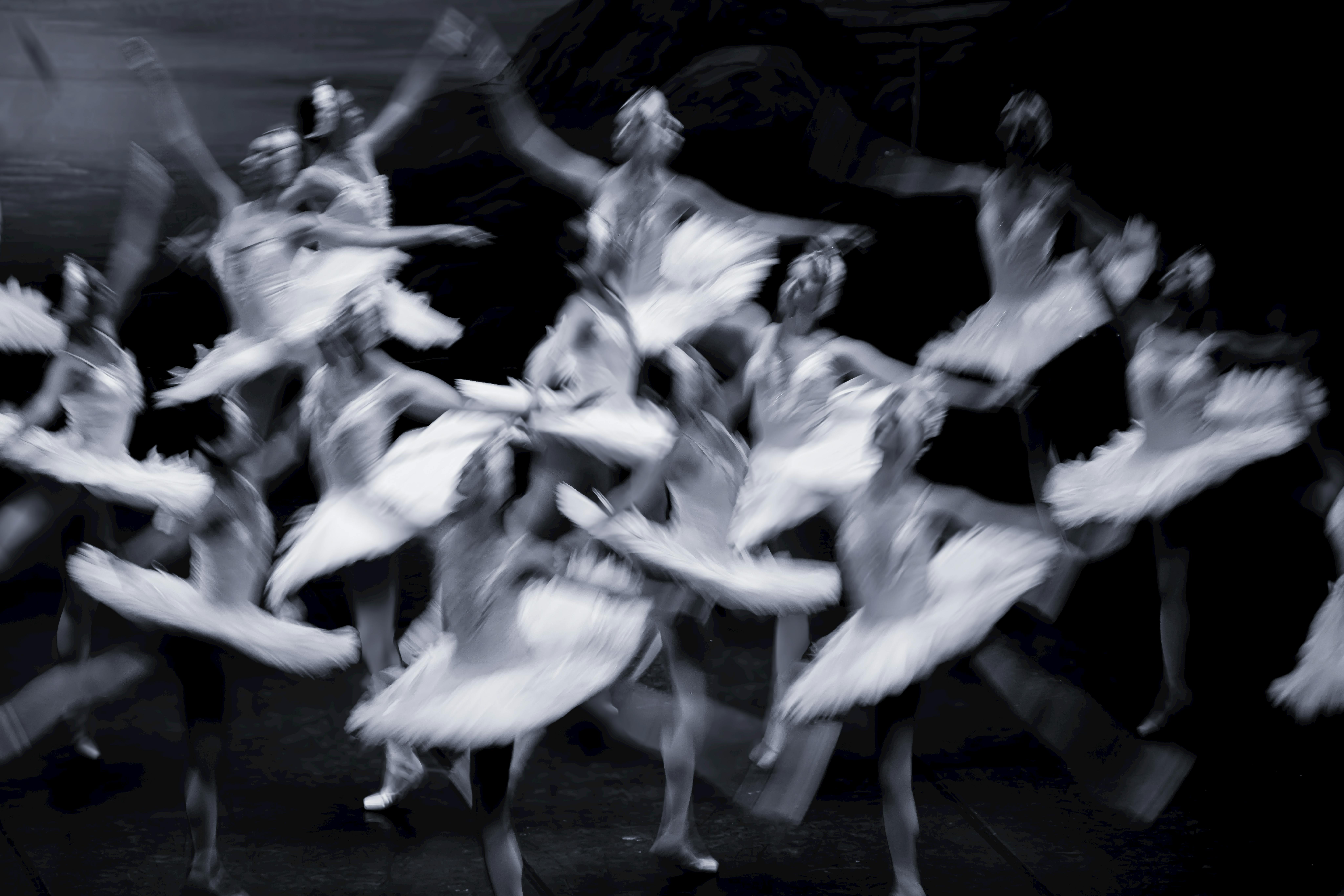 Free Artistic capture of ballerinas in motion, displaying grace and fluidity on stage. Stock Photo