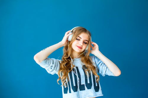 Women Wearing A Headphone
