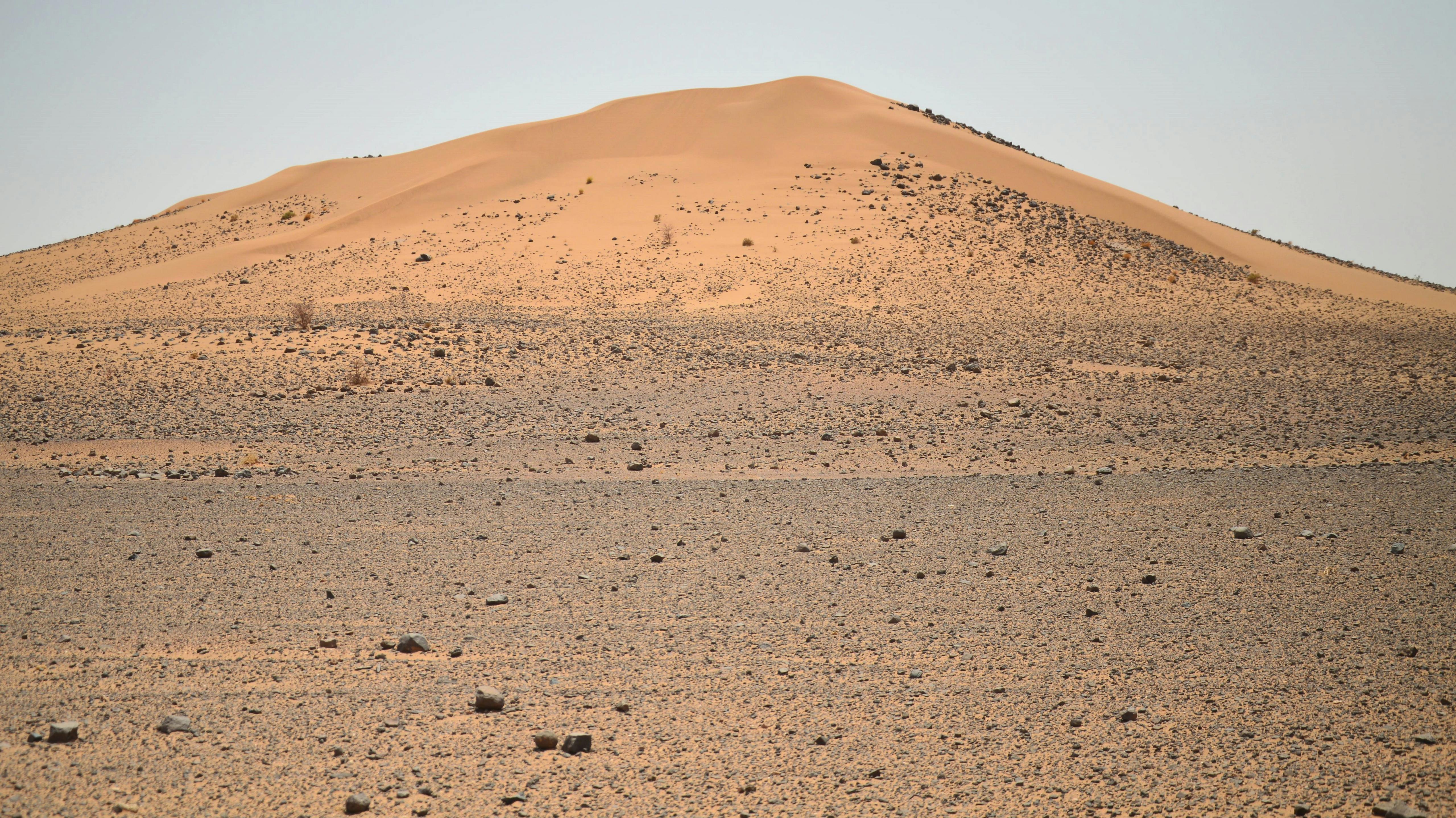 a large sand dune in the middle of a desert