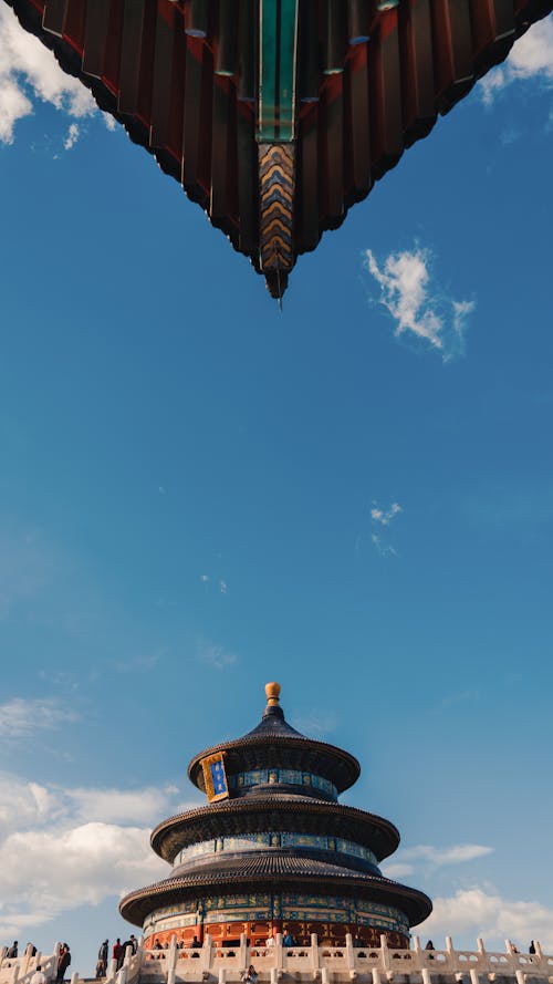 Free A captivating shot of the Temple of Heaven showcasing traditional Chinese architecture under a vast blue sky. Stock Photo