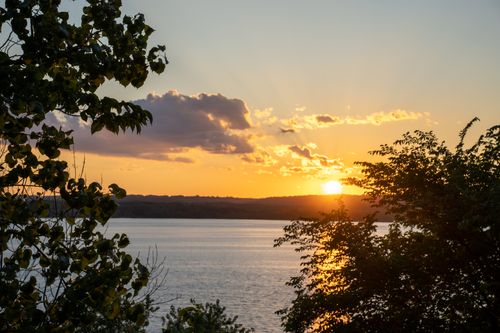 Free Beautiful sunset over a lake with silhouetted trees in Stockholm, Wisconsin. Stock Photo