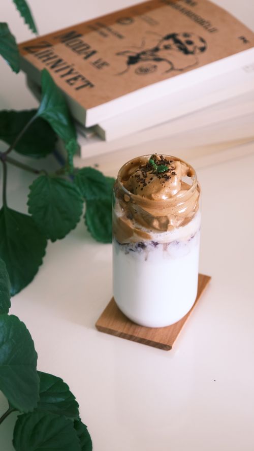 Free Creamy dalgona coffee with milk and mint, perfect for morning breakfast indulgence. Stock Photo