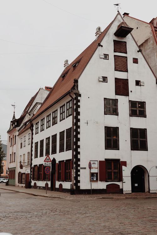 Free Explore the classic architectural beauty of Old Riga, featuring traditional European facades and cobblestone streets. Stock Photo