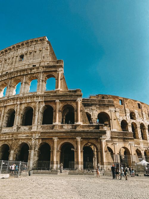 Free The iconic Roman Colosseum captured in daylight, highlighting its historical architecture. Stock Photo