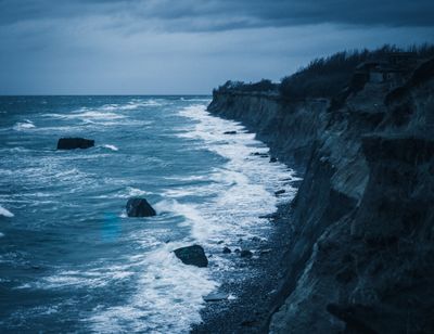 Coastal cliffs under a moody sky by Phil S on Pexels