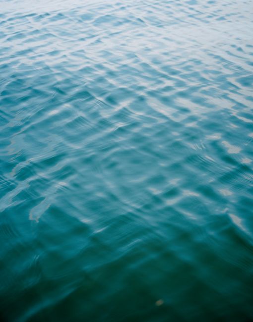 A peaceful view of turquoise ocean waves creating a soothing abstract pattern.
