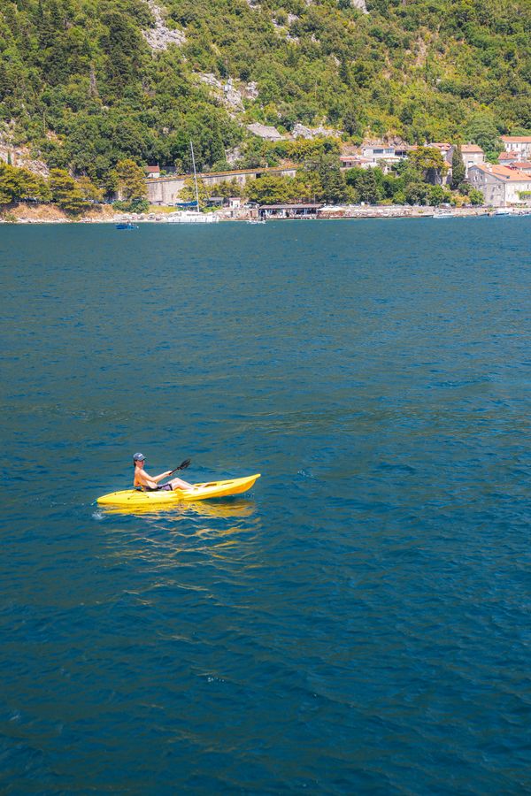 Kayaking at sunrise in Kotor Bay — stay connected while travelling