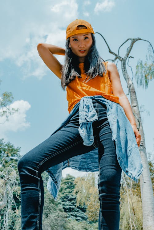 Woman Wearing Yellow Top And Denim Jeans