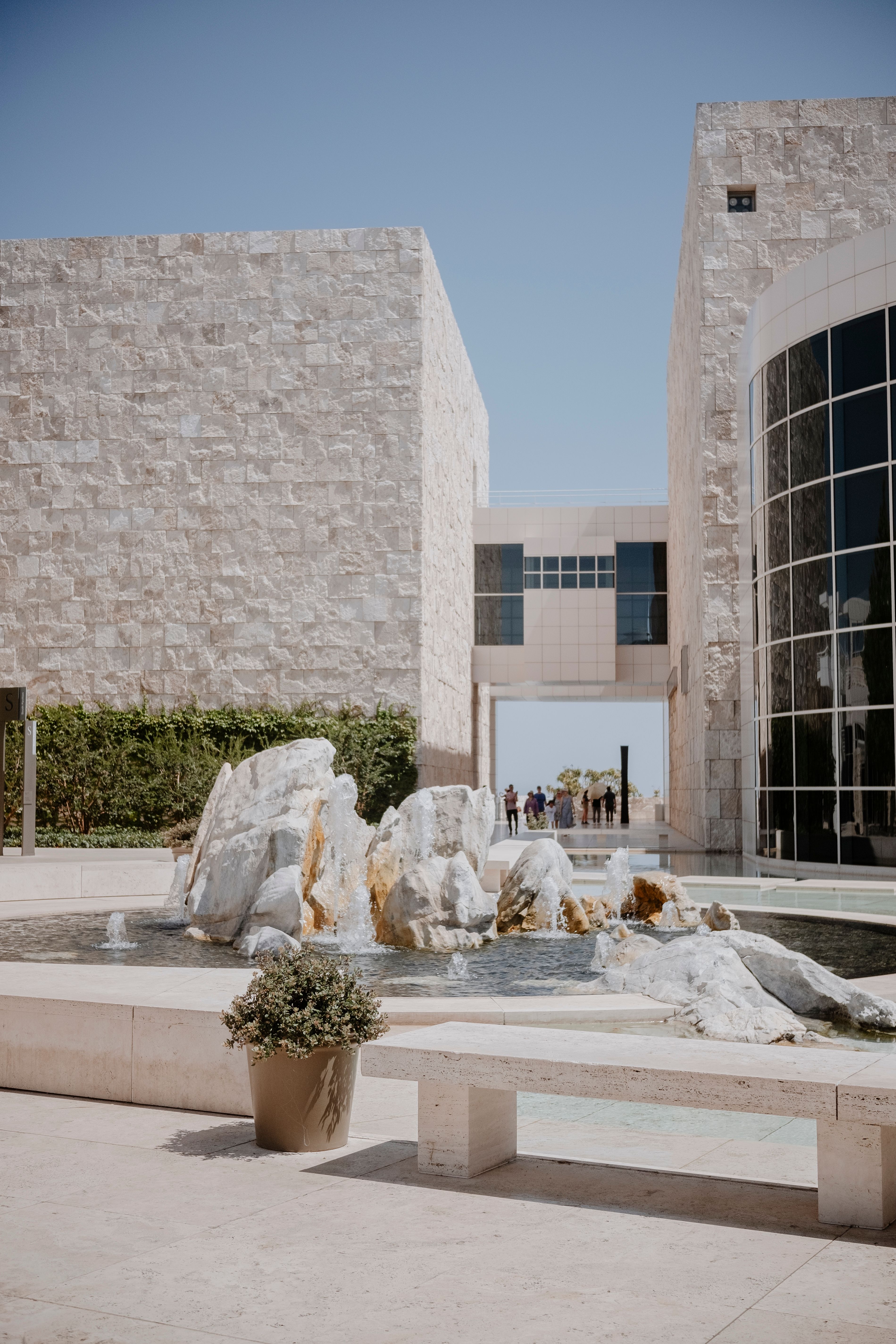 The fountain in front of the building is surrounded by rocks · Free ...