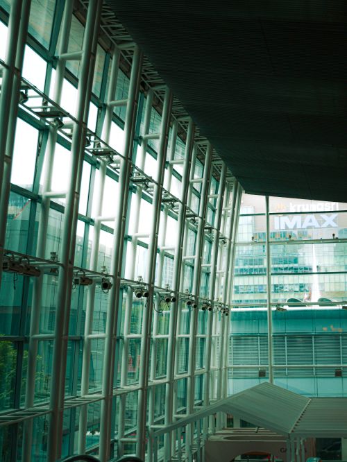 Free Futuristic interior view of a modern shopping mall in Bangkok, showcasing glass and steel design. Stock Photo