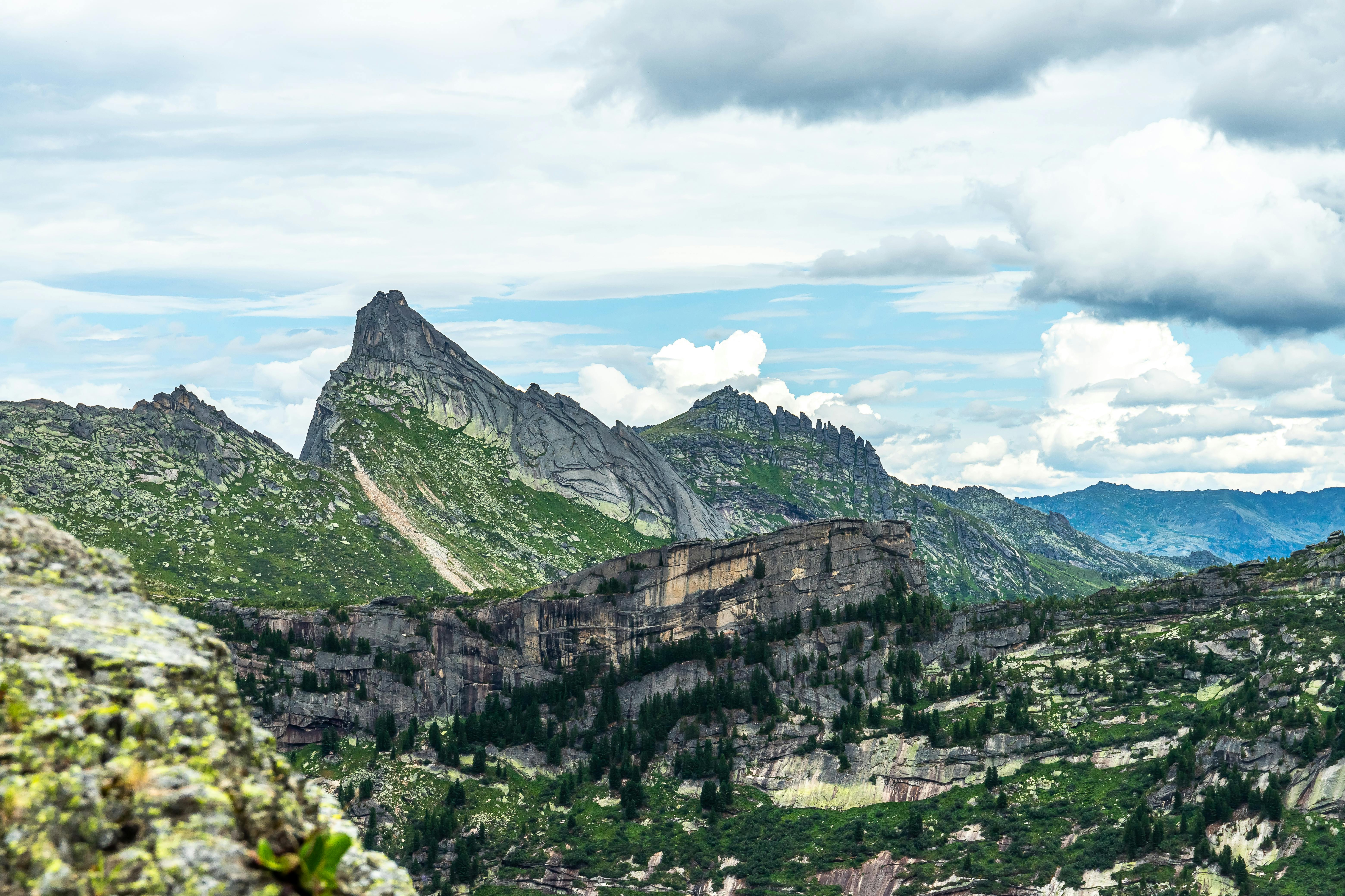 a view of the mountains from a rocky area