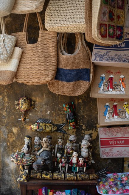 Explore a vibrant display of traditional Vietnamese handicrafts and souvenirs in Hội An's market.