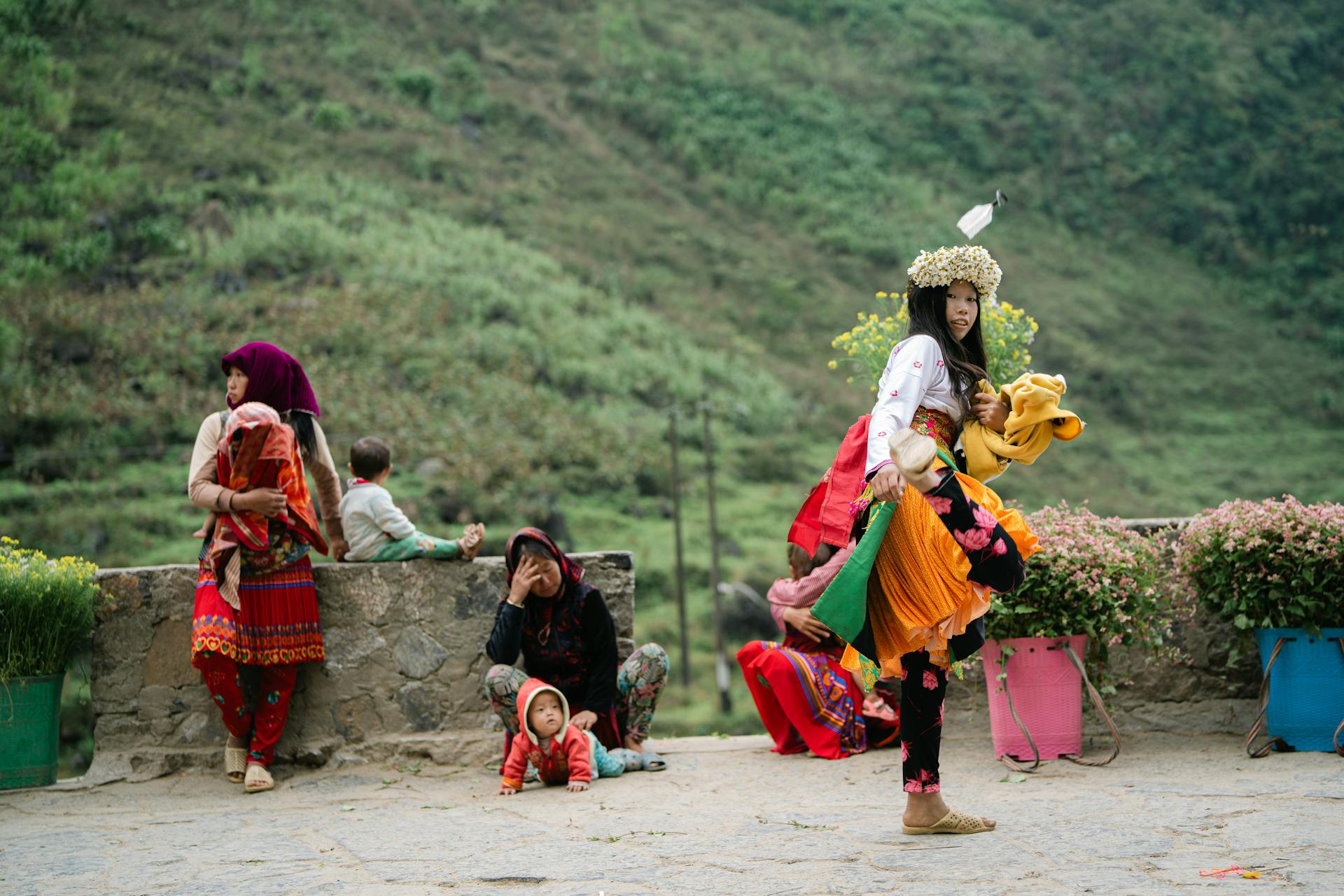 People in traditional attire at a festival in Hà Giang, capturing vibrant cultural practices.