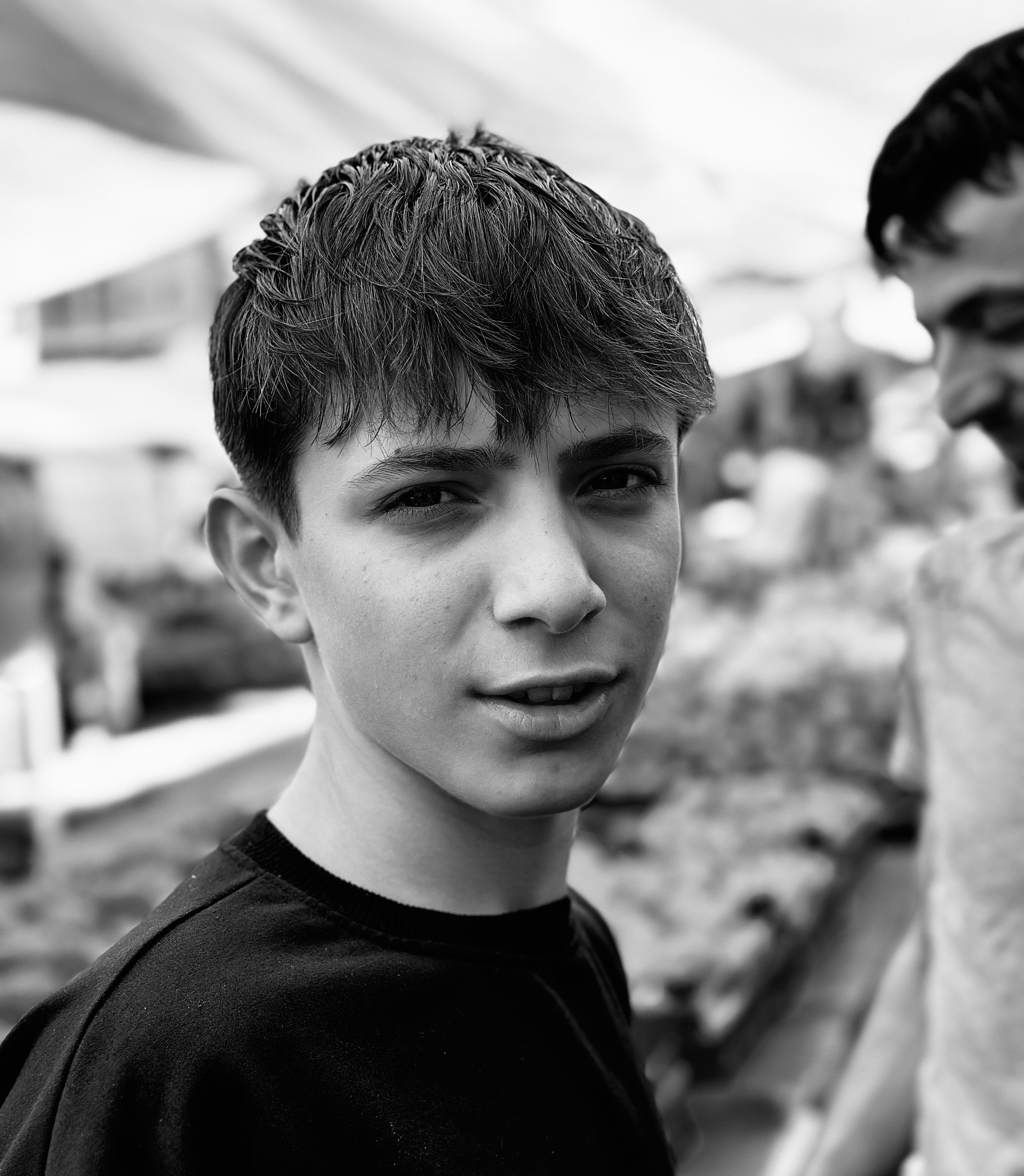A young man is standing in front of a crowd · Free Stock Photo