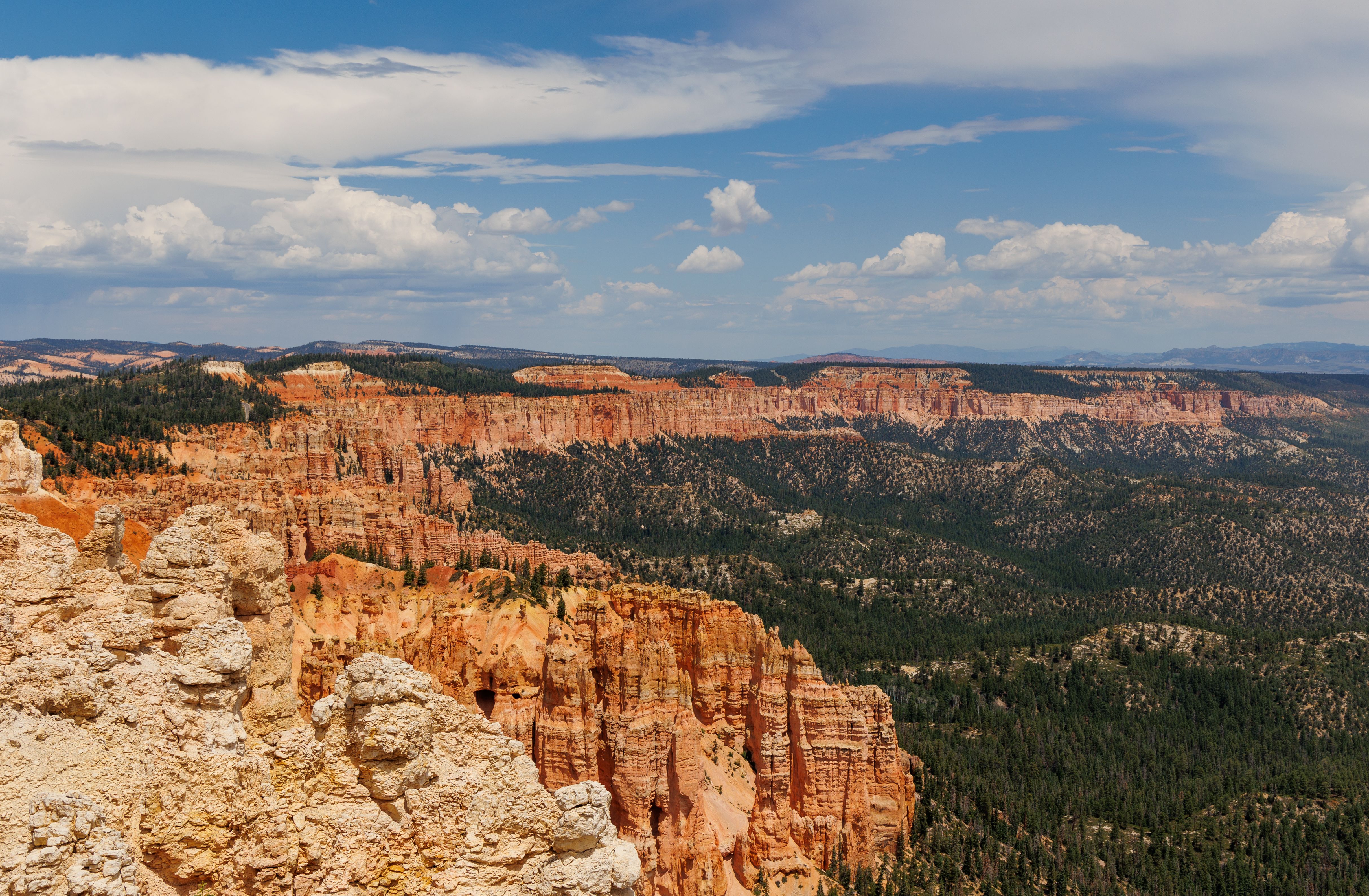 Stunning view of Bryce Canyon's red rock formations under a sunny blue sky.