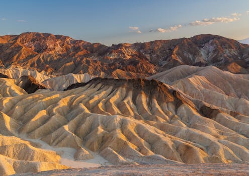 Stunning sunset view of the unique geological formations at Zabriskie Point, Death Valley.