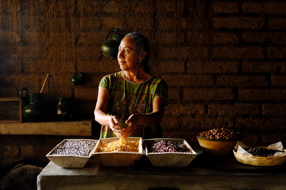 Traditional mole preparation lesson in an Oaxacan kitchen with colorful chiles, spices, and grinding stones, while an indigenous chef demonstrates ancient techniques - chef-led experiences Traditional mole preparation lesson in an Oaxacan kitchen with colorful chiles, spices, and grinding stones, while an indigenous chef demonstrates ancient techniques - chef-led experiences