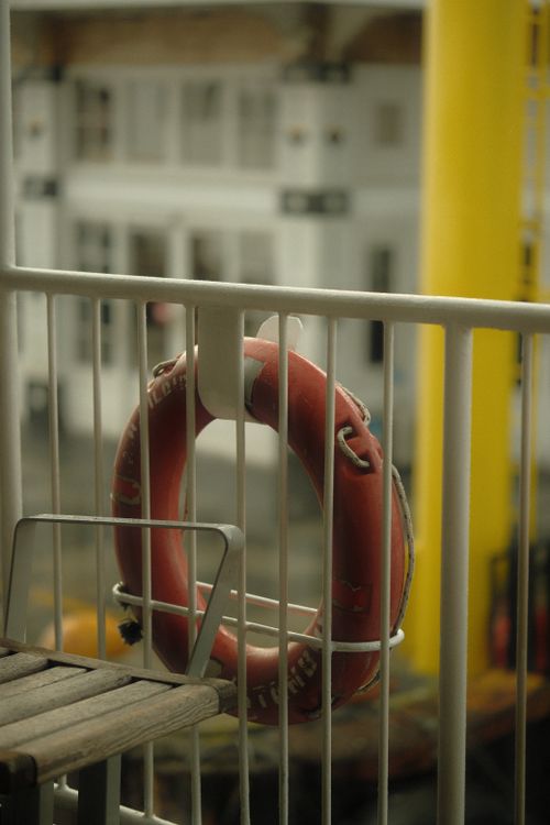 Free A red life buoy captured on a ship deck at Istanbul port, Türkiye, showcasing maritime safety equipment. Stock Photo