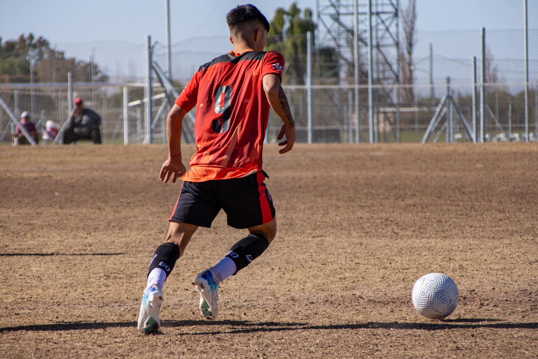 wing-back sprinting down the touchline during an intense 3-5-2 tactical training session