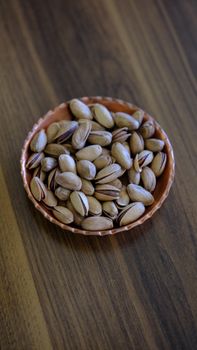 A bowl of crunchy pistachios offering a healthy snack from Gaziantep, Türkiye.
