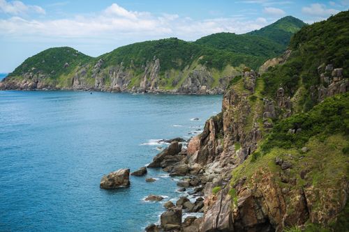 Free Stunning seaside cliffs and lush greenery in Tuy Hòa, Phú Yên, Vietnam, showcasing tranquil ocean views. Stock Photo